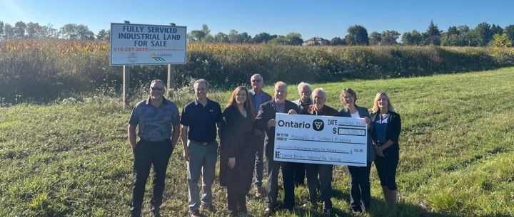 Southwest Middlesex Secures $2.065M in Funding for Glencoe Industrial Park Municipal Staff Councillors and County Staff holding a cheque in front of the industrial park.