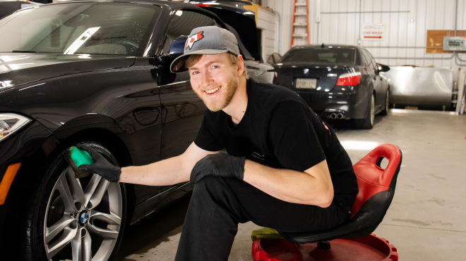 Man detailing a car 