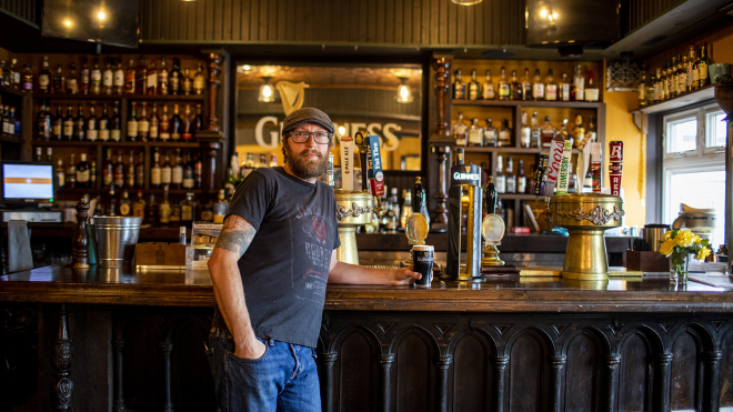 Owner inside Crown and Turtle Pub 