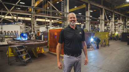 Man in front of machinery 