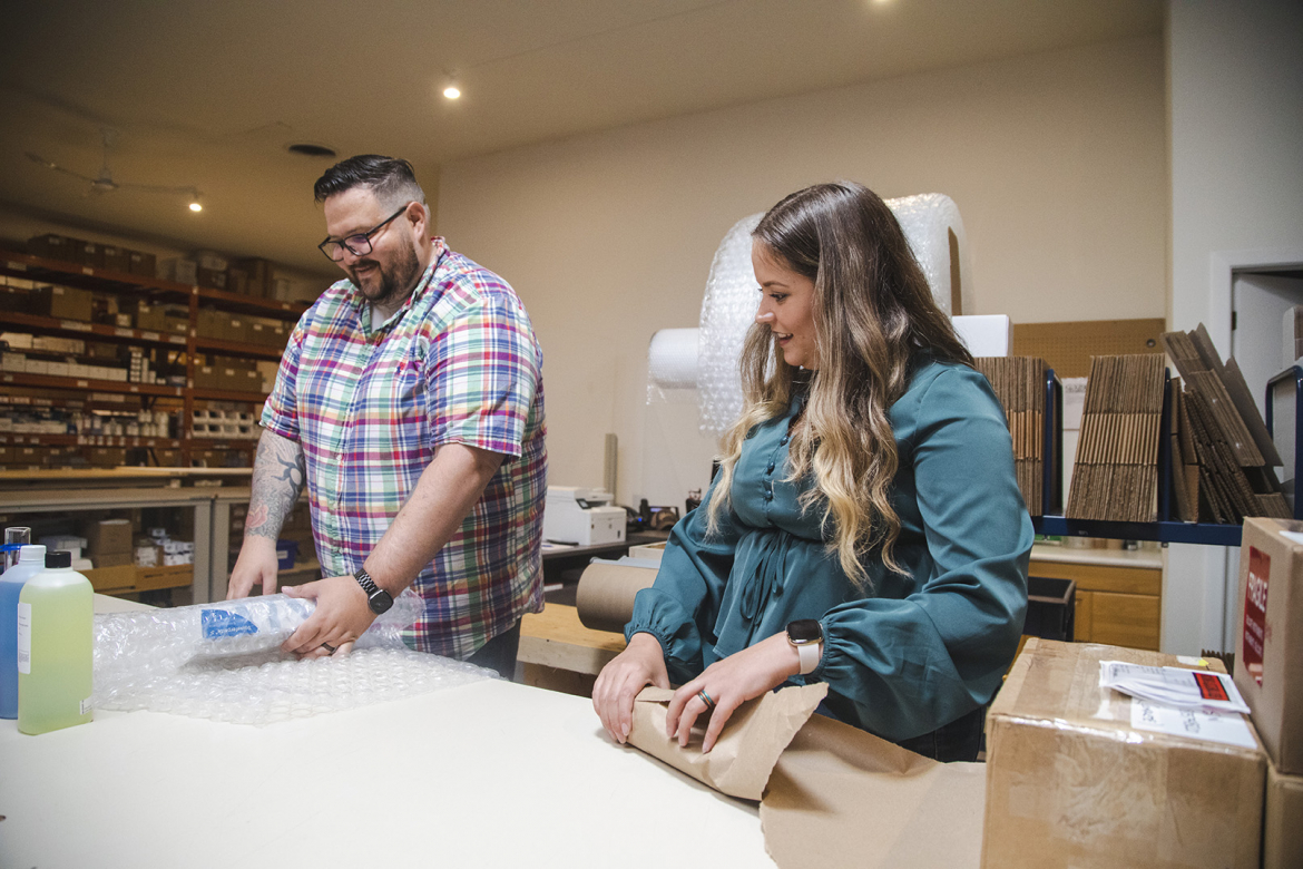 Man and woman packing boxes