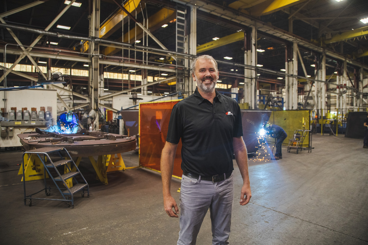 Man in front of machinery 