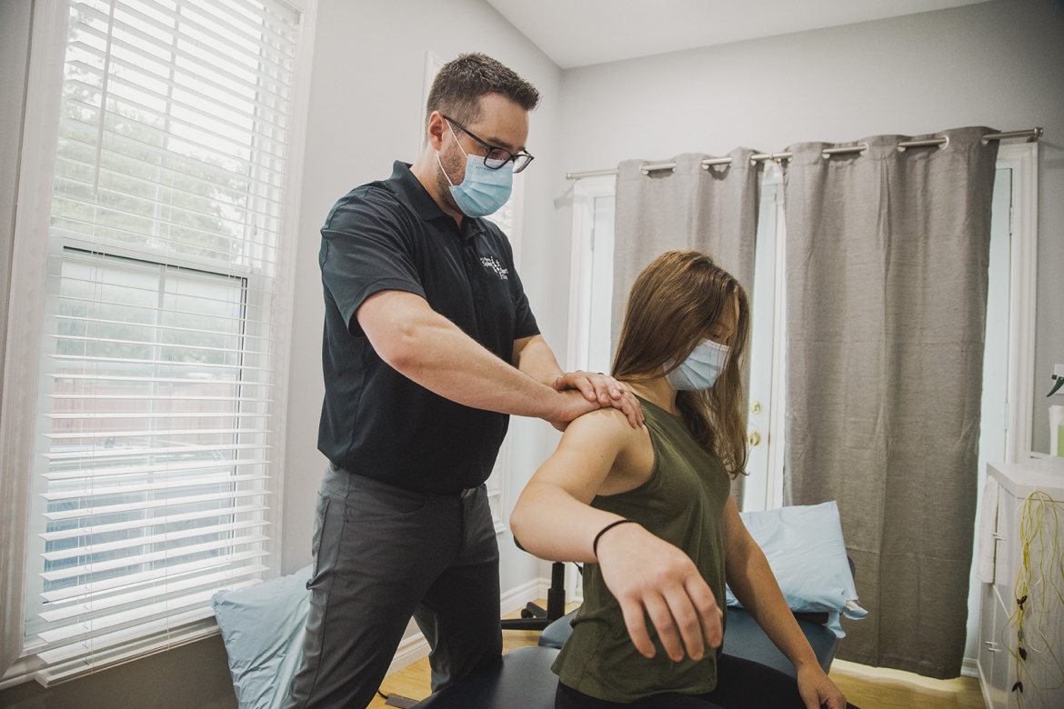 Chiropractor doing adjustments on patient